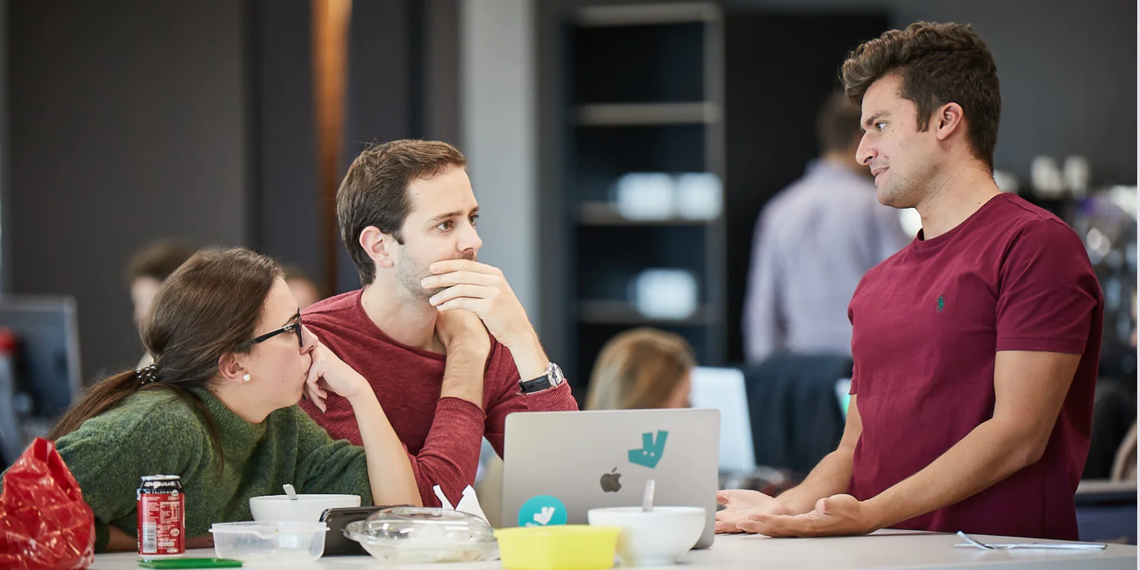 deliveroo office team discussing how to optimize the communication process with the app customers deliveroo office team discussing how to optimize the communication process with the app customers